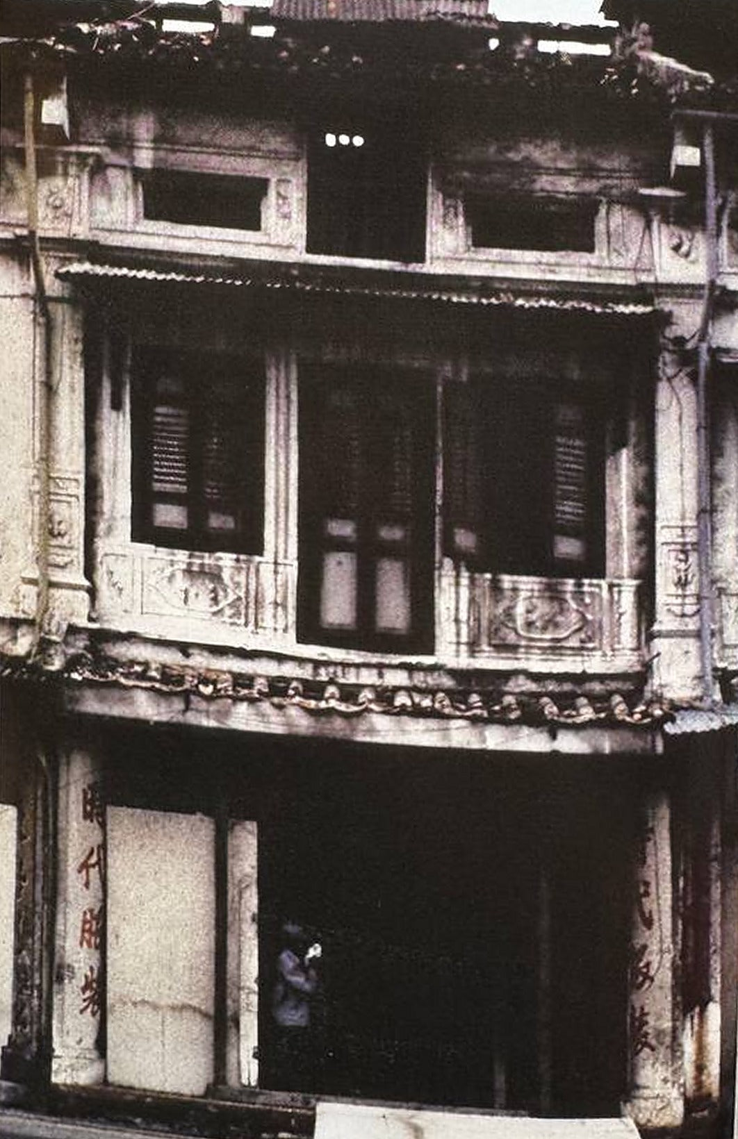 9 Neil Road before restoration, its roof and windows damaged
