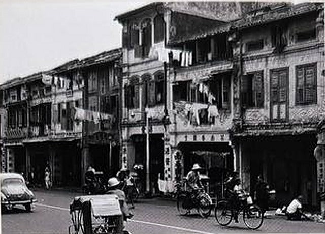 Shophouses along Tanjong Pagar Road before restoration, with rickshaws and bicycles in the street