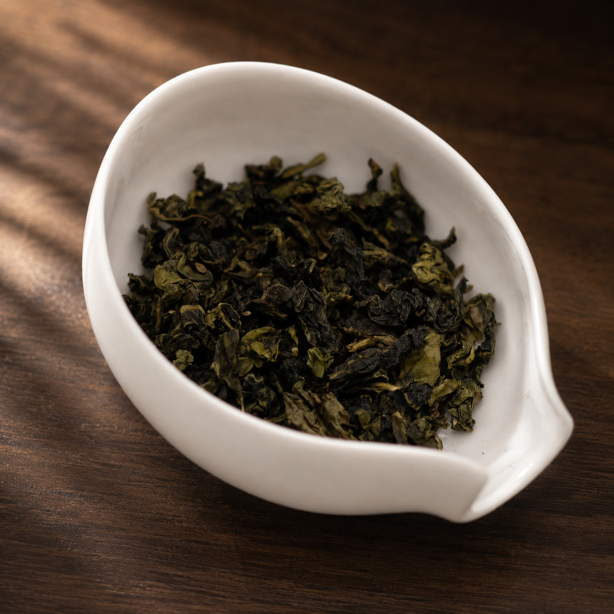 Supreme Grade Tie Guan Yin in warm window light - Tea Chapter Singapore
